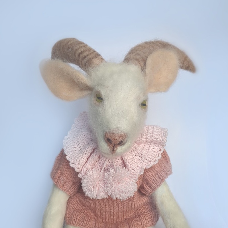 A handcrafted doll of Peace the Saanen Goat